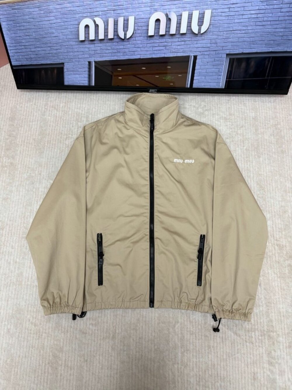 Miu Miu khaki zip-up jacket with a sporty stand-up collar – Size M